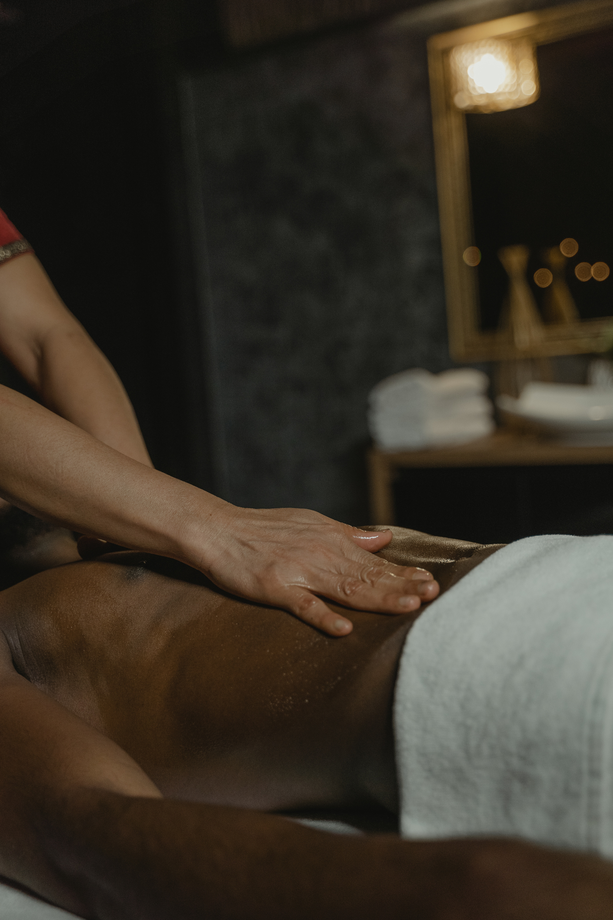 Hands Massaging Male Body